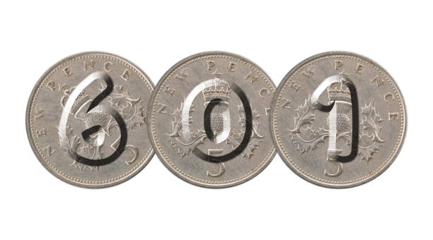 istock Number 601  with old coins on white background 944011932