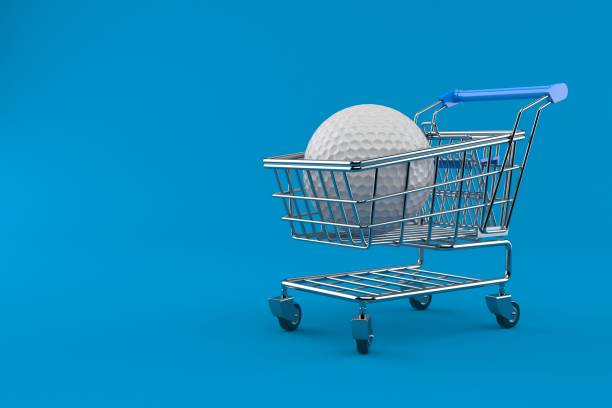 istock Golf ball with shopping cart 944012086