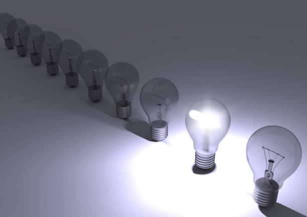 istock Group of incandescent light bulbs with one bulb illuminated. 944022436