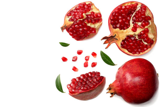 istock pomegranate fruit with green leaves isolated on a white background top view 944028370