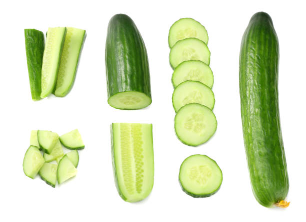 istock fresh cucumber slices isolated on white background. top view 944028410