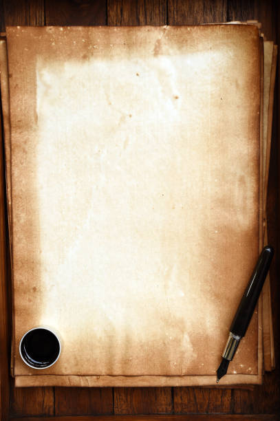istock old paper on brown wood texture with pen and ink 944042532