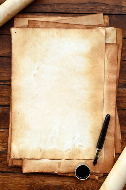 istock old paper on brown wood texture with pen and ink 944043412