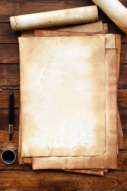 istock old paper on brown wood texture with pen and ink 944043434