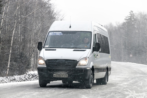 Chelyabinsk region, Russia - February 10, 2018: Passenger bus Mercedes-Benz Sprinter at the interurban road.