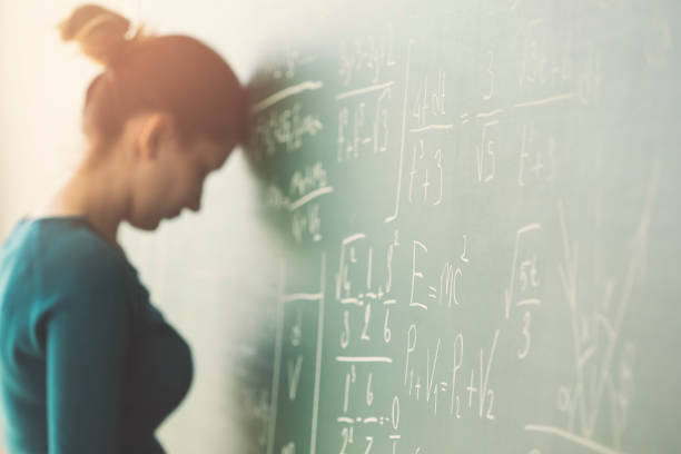 Young girl student in front of chalkboard