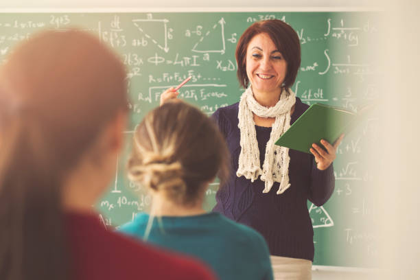 istock Teacher giving lesson to students in  classroom 944046922