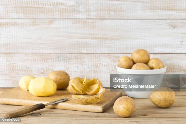 Raw And Peeled Potatoes Stock Photo - Download Image Now - Raw Potato, Peel - Plant Part, Cooking