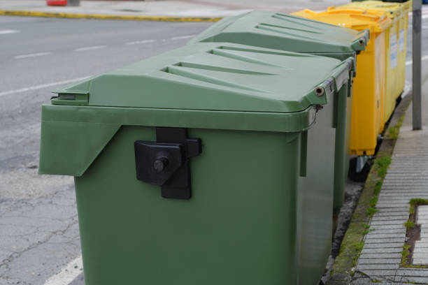 istock green and yellow garbage cans on the street 944048404