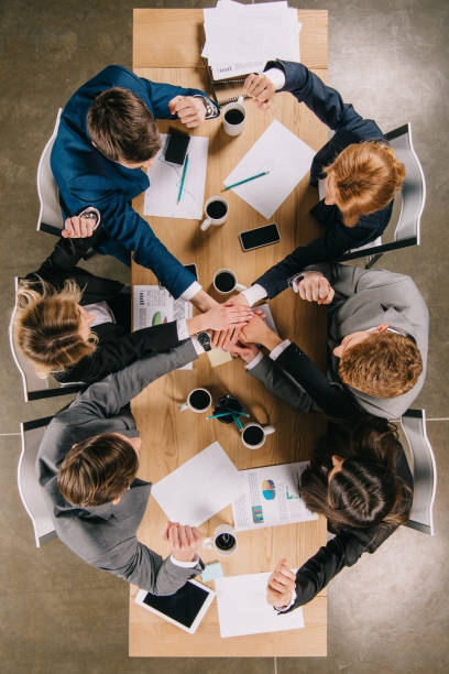 istock Top view of colleagues at table in office, businesspeople teamwork collaboration relation concept 944052900
