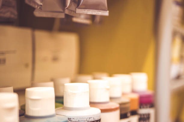 istock shelf with draw paint cans standing in a raw 944065014