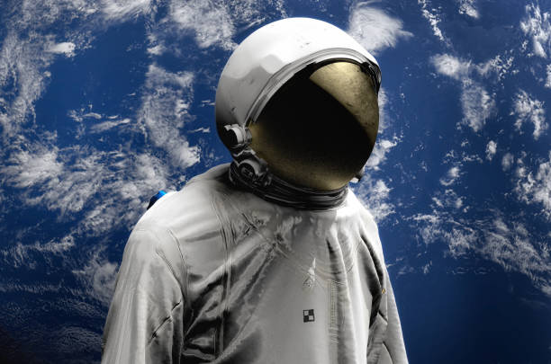 istock Astronaut on space mission flying around our blue planet. Earth on background. Cosmos. 3D render 944068790