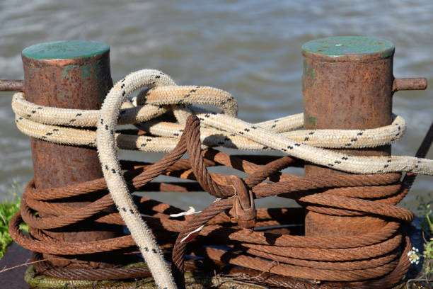 Thick Boat Ropes Tied To An Old Rusty Bollard Stock Photo - Download Image  Now - Anchor - Vessel Part, Bollard, Cleat - iStock