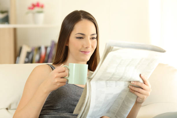 istock Woman reading a newaspaper in the morning 944069794