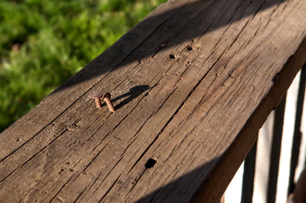 istock Rusty nail in a wooden board 944072132