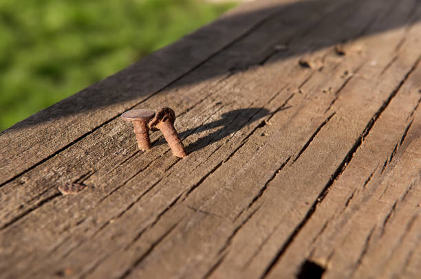 istock Rusty nail in a wooden board 944072394