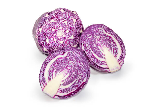 istock Different halves of the red cabbage on a white background 944079898