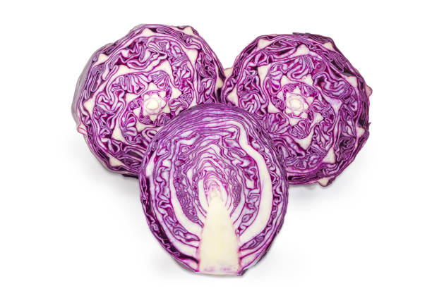 istock Three halves of the red cabbage on a white background 944080014