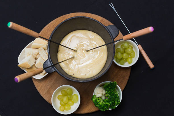 a cheese fondue on a table top - fruit sauce imagens e fotografias de stock