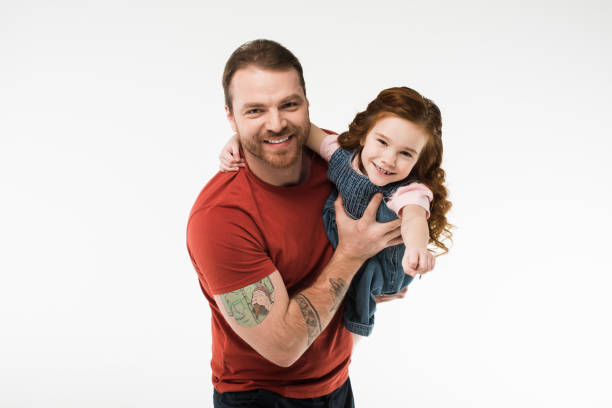 istock Smiling father holding daughter in hands isolated on white 944080318