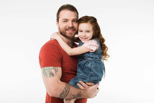 istock Little kid sitting in father hands isolated on white 944084824