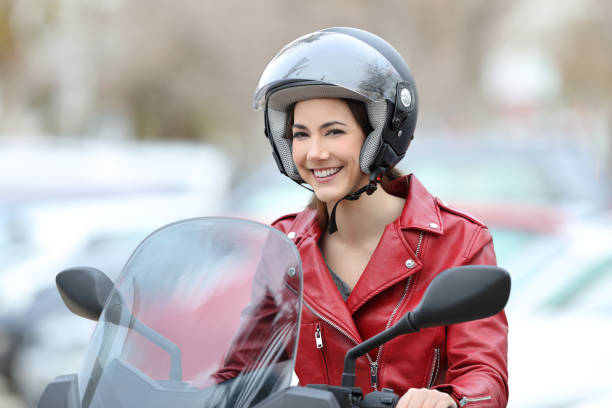 istock Happy biker on a motorbike looking at you 944085590