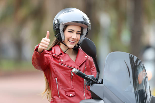 istock Biker looking at you with thumb up outside 944085820