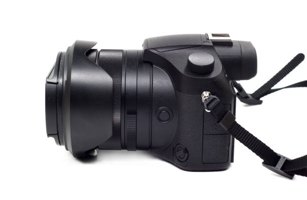 istock Photo camera isolated on white background. Modern ultra zoom photo camera front view. 944089902