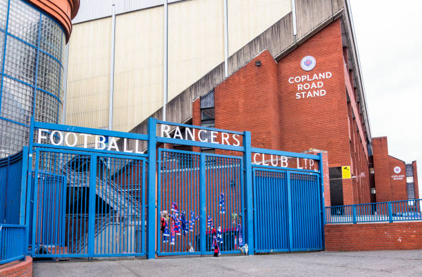 Ibrox Stadium: Rangers Football Club Gates Glasgow, Scotland, UK - Scarves tied to entrance gates to Ibrox Stadium, the home of Rangers Football Club. ibrox stock pictures, royalty-free photos & images