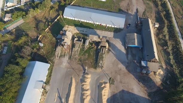 istock Hangar for storage of grain. A platform for drying and sintering grain. Harvested grain 944093530