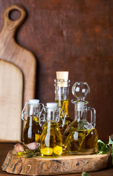 istock olive oil in glass bottles 944097116