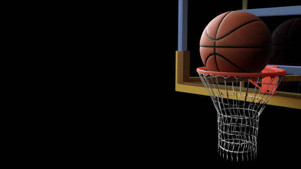 istock Basketball going into hoop on black isolated background. Sport and Competitive game concept. 3D illustration. 944097942