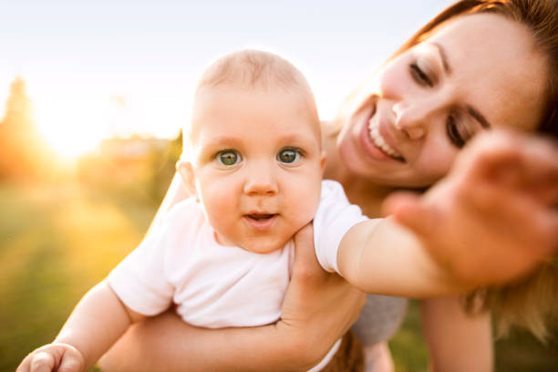 istock Young mother holding baby son in her arms. 944098268