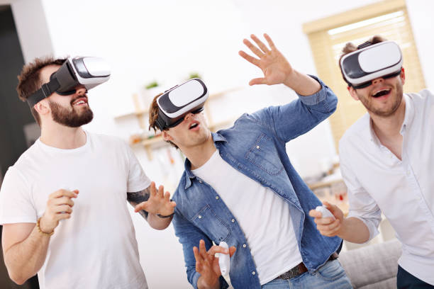 istock Friends having fun on the couch with video games 944103332