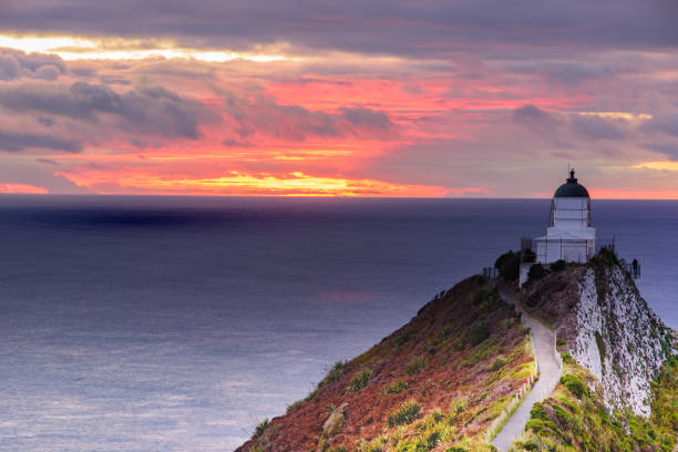 istock Lighthouse sunrise at Nugget Point,Tokata Wall 5 944103386