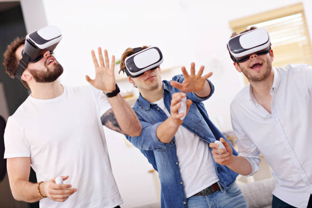 istock Friends having fun on the couch with video games 944103408