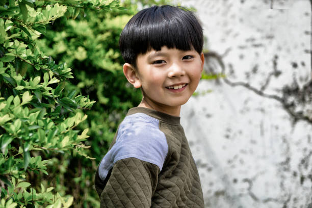 istock Asian little boy looking at camera 944108526