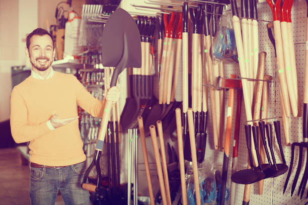 istock Man demonstrating a garden shovel 944120348