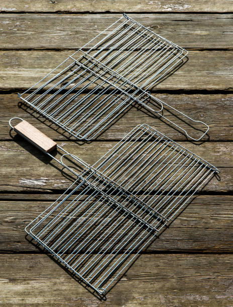 istock Steel grill rack isolated on grass in garden 944125122
