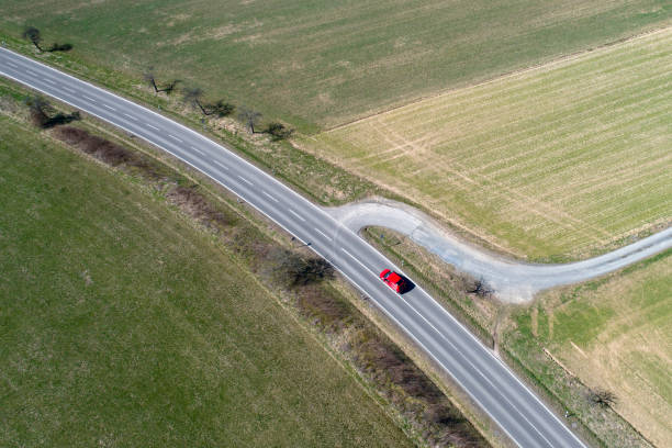 istock Road through agricultural area - aerial view 944125330