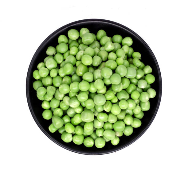 istock fresh green peas isolated on a white background. Studio photo 944125432