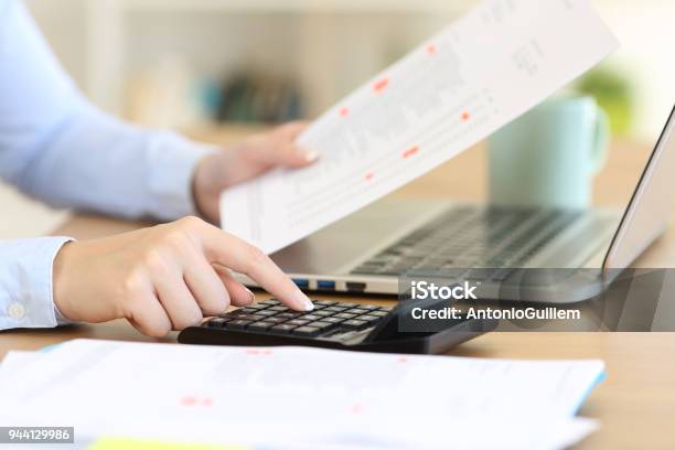 Accountant Calculating With A Calculator On A Desk Stock Photo - Download Image Now - Home Finances, Budget, Financial Bill