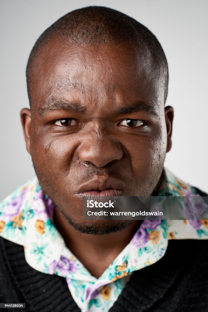 Studio Portrait Of African Man Making A Funny Face Stock Photo - Download  Image Now - Adult, Adults Only, Bizarre - iStock