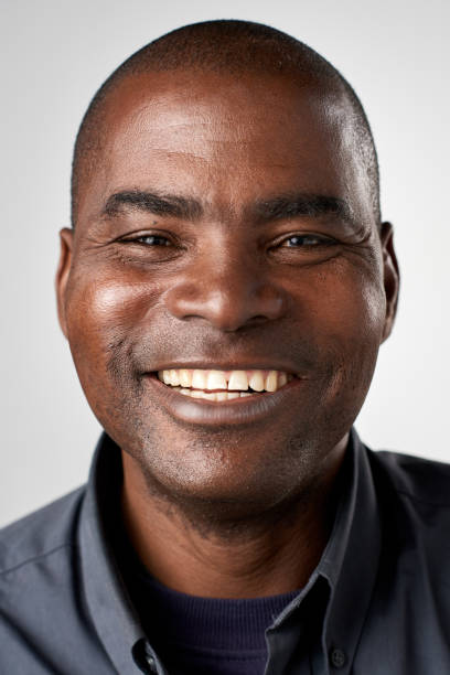 istock Laughing studio portrait of mixed race man 944138036