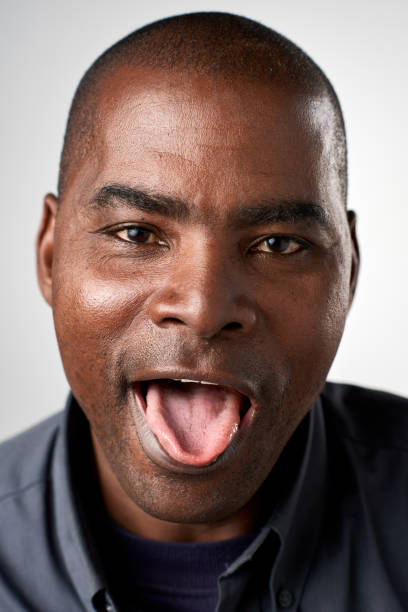istock Studio portrait of mixed race man pulling a silly face 944138158
