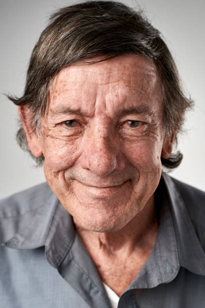 istock Smiling studio portrait of old white man 944138354