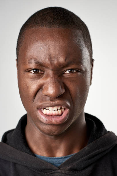 istock Studio portrait of African man pulling a silly fun face 944138386