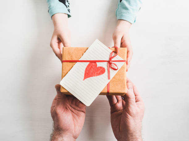 istock Father's hands and the youngest daughter 944142648