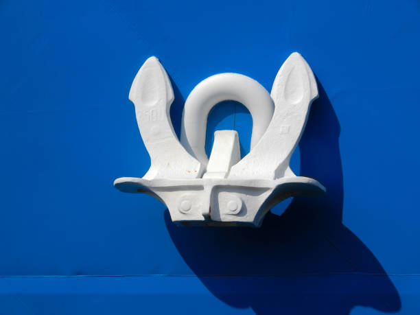 Close up of an anchor on a ship's hull.
