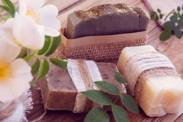 istock Three pieces of dry soap with white roses 944152204